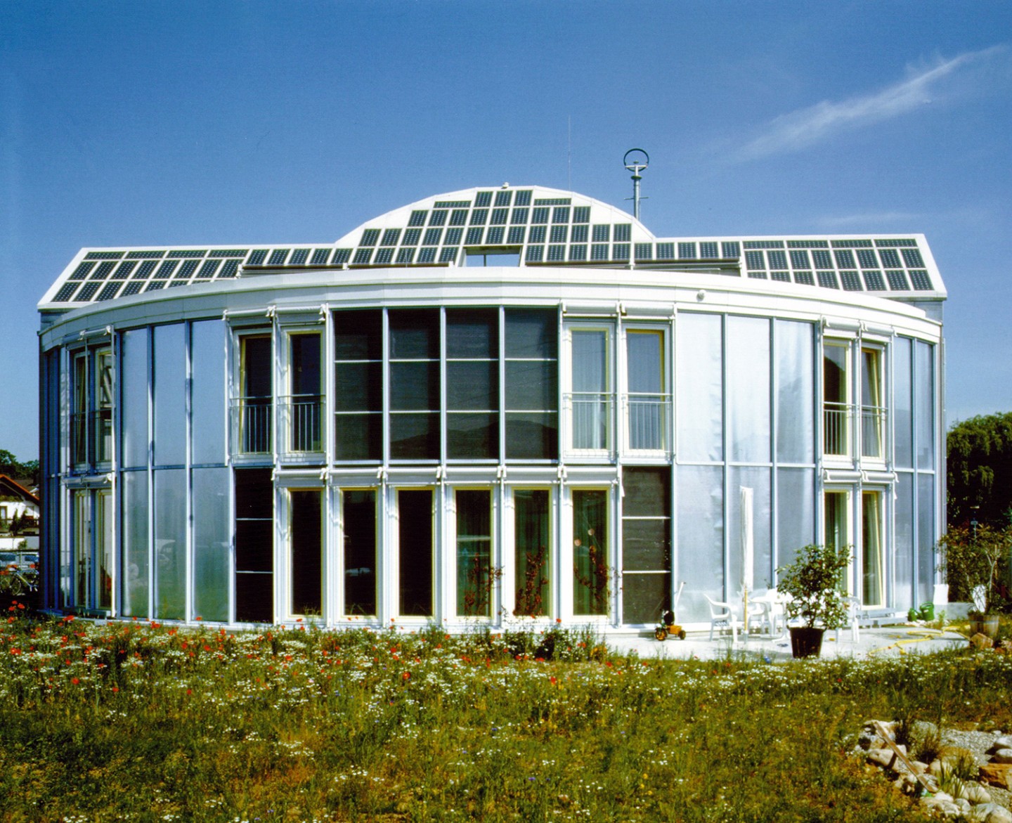 Completed in 1992, the solar house covers its entire energy needs from solar power.