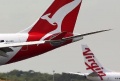 As Australia repeals carbon tax, Qantas removes its domestic flight surcharge but says fares won't drop | Qantas,Virgin Australia